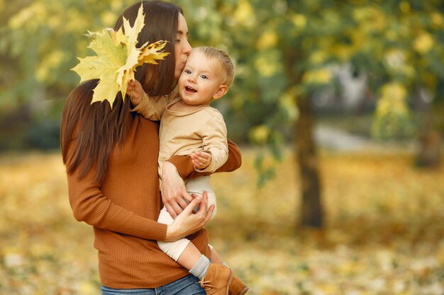 Cute and stylish family in a autumn park