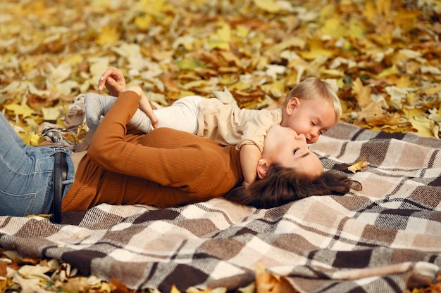 Cute and stylish family in a autumn park