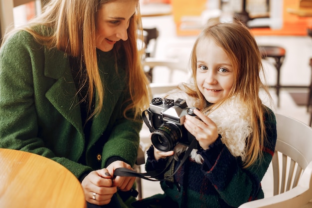 Free photo cute and stylish family in a cafe