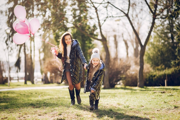 Cute and stylish family in a spring park