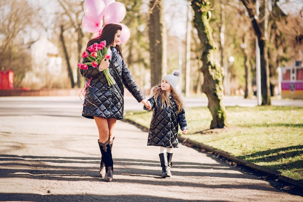 Cute and stylish family in a spring park