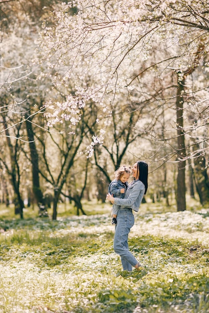 Cute and stylish family in a spring park