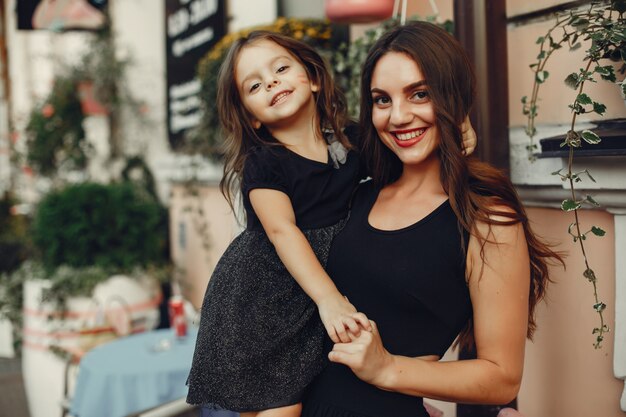 Cute and stylish family in a summer city