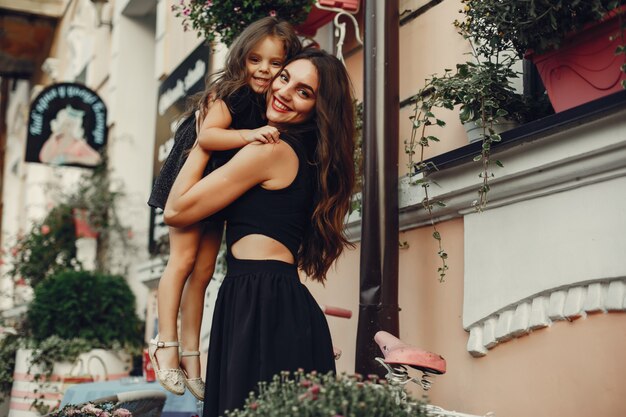 Cute and stylish family in a summer city