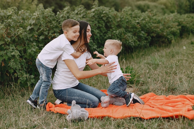 Cute and stylish family in a summer park