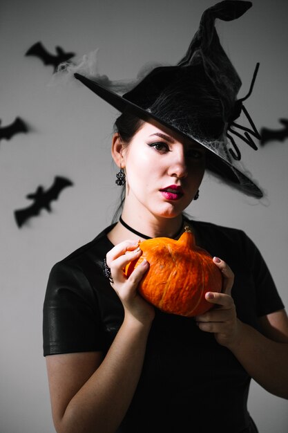 Cute witch with pumpkin