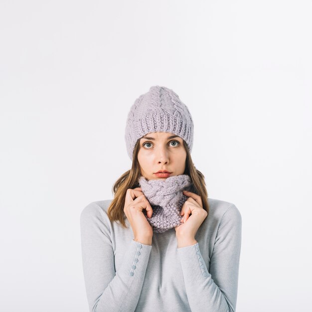 Cute woman in adjusting scarf