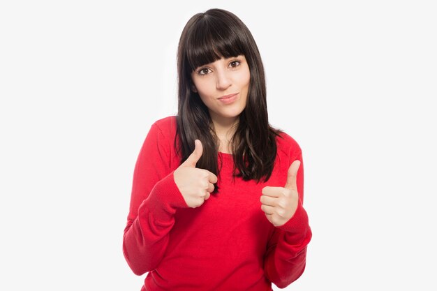 Cute woman gesturing thumb-up