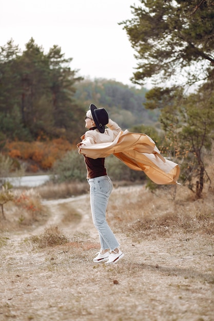 Cute woman have a rest in a autumn park