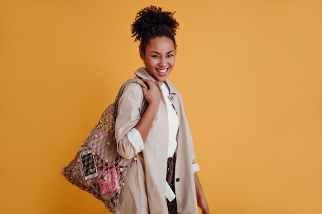 Cute woman posing with string bag