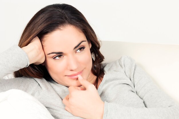 Cute woman on the sofa at home