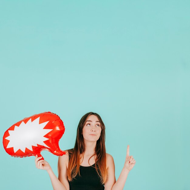 Cute woman with speech bubble pointing up