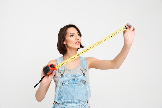 Free photo cute woman with tape measure renovate house