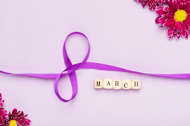 Cute women's day ribbon symbol with flowers