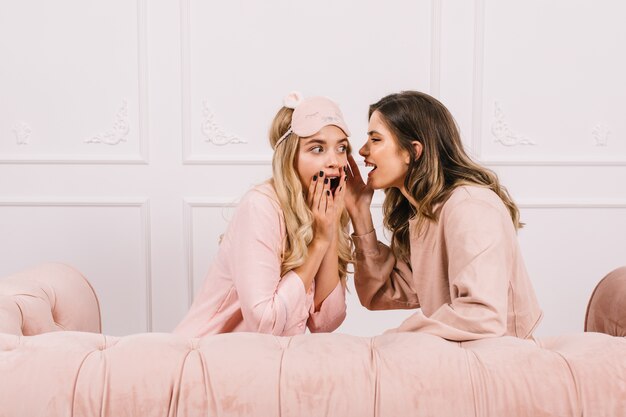 Cute women sharing gossips