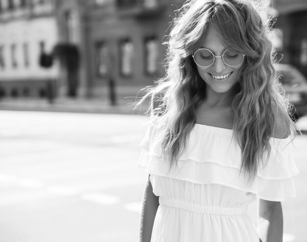 cute young blonde woman with sunglasses