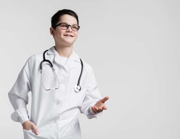 Cute young boy dressed up as a doctor