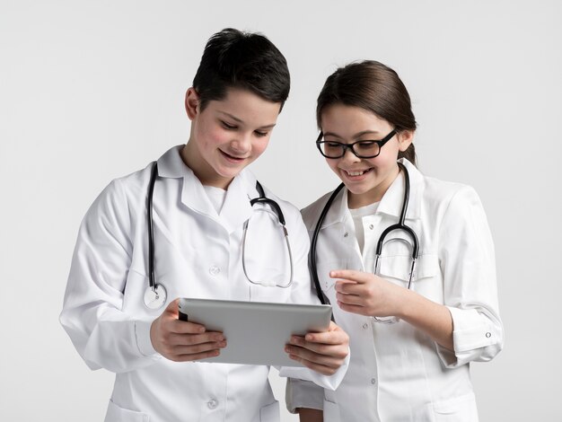 Cute young boy and girl using a tablet together