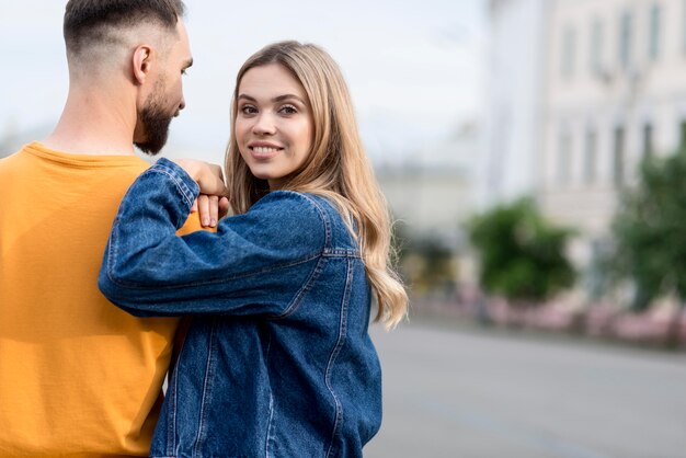 Cute young couple and blurred street