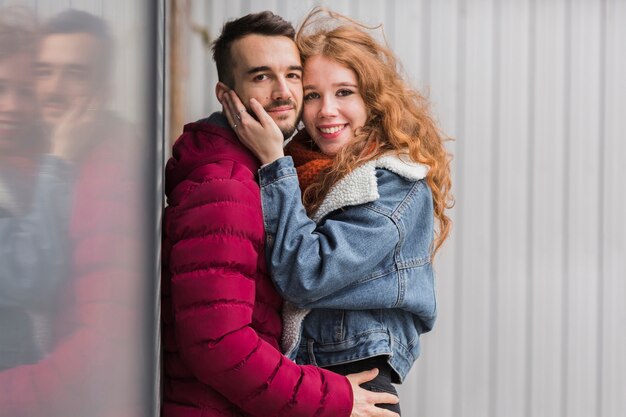 Cute young couple embracing each other