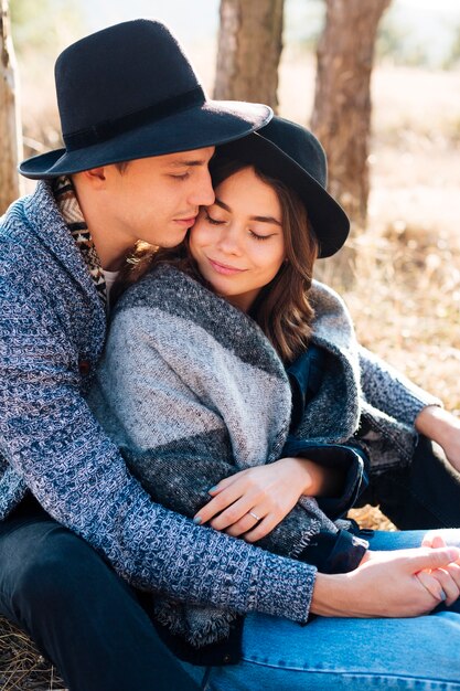 Cute young couple hugging in the nature