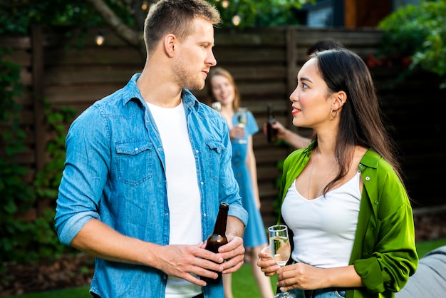 Cute young man and woman looking at each other