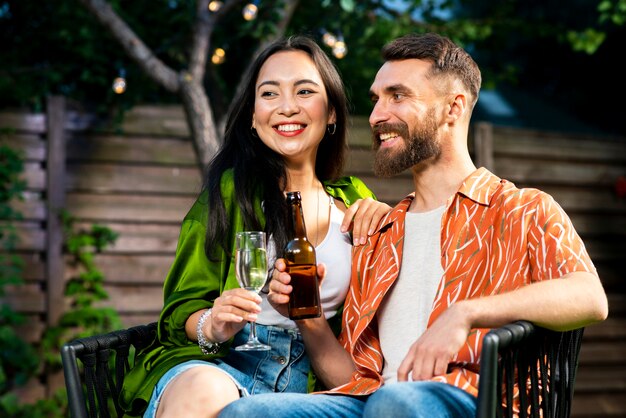 Cute young man and woman together with drinks