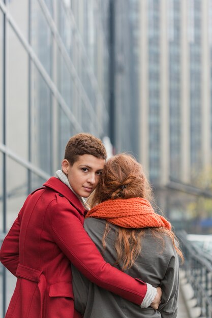 Cute young woman holding her partner