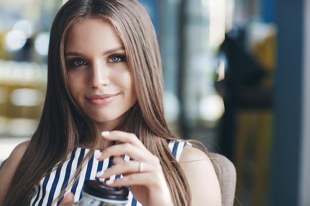 cute young woman indoor in restaurant or cafe