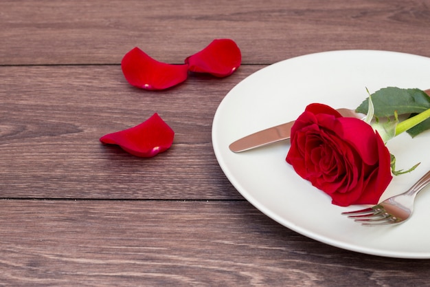 Cutlery with flower on plate