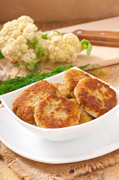 Cutlets cauliflower with fennel, garlic and cheese sauce