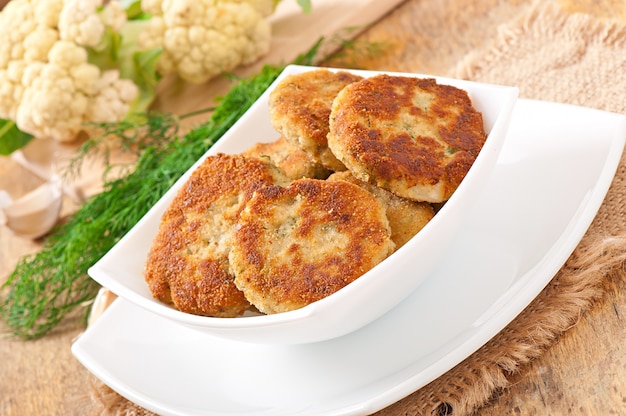 Cutlets cauliflower with fennel, garlic and cheese sauce