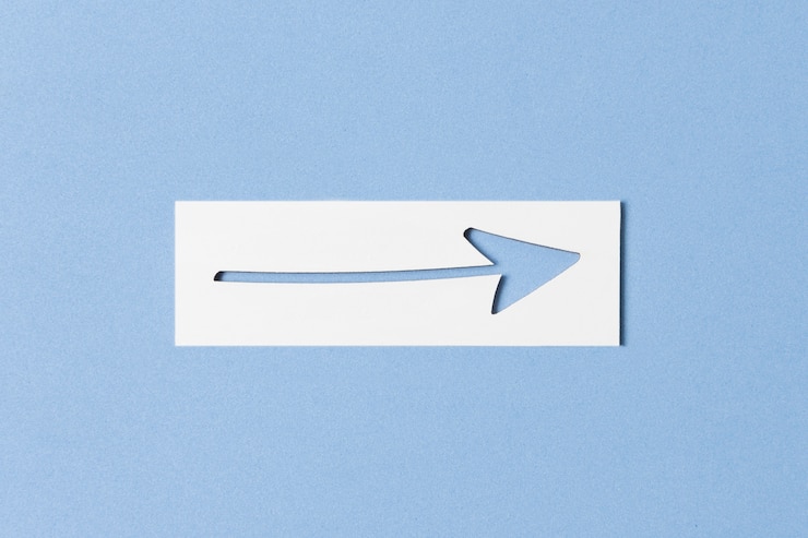 Free Photo cutout arrow and piece of paper