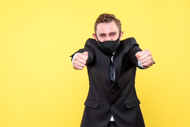 Cutout of overworked and stressed businessman standing on yellow