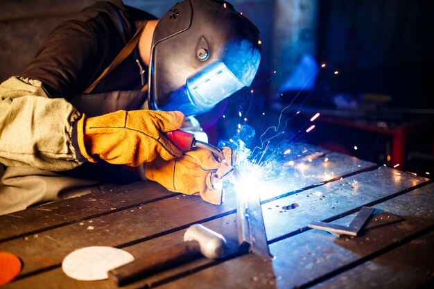 Cutting metal with plasma equipment on plant.