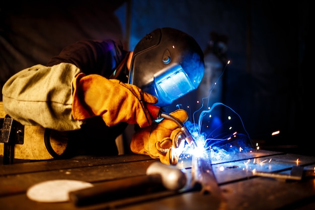 Cutting metal with plasma equipment on plant.