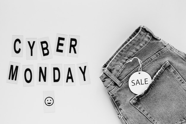 Cyber monday text next to jeans with sale tag