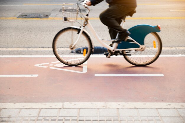 Cycle lane with cyclist riding bicycle
