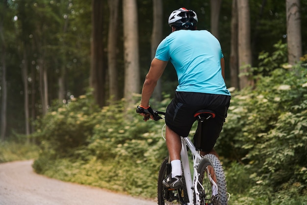 Cyclist on the ride in  the forest