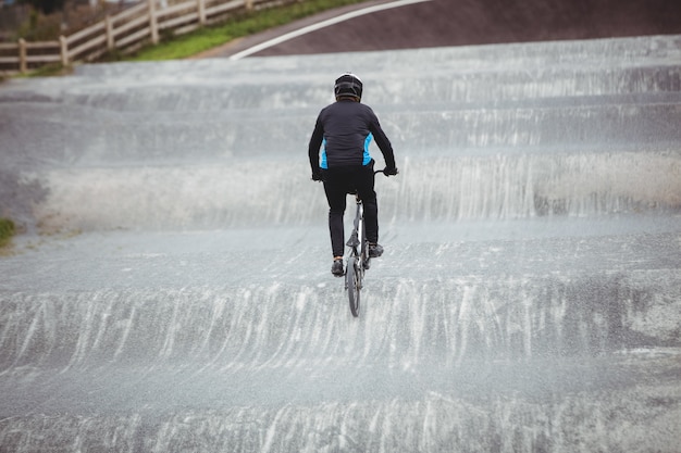 Cyclist riding BMX bike