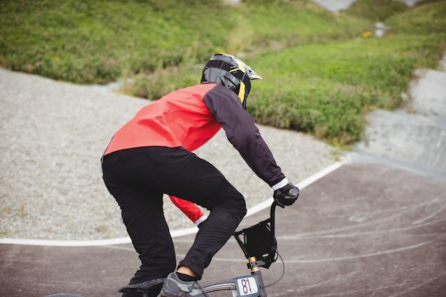 Free photo cyclist riding bmx bike