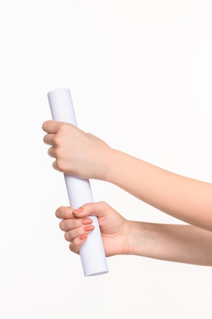 Free photo the cylinder female hands on white background