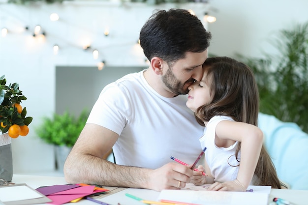 Dad and daughter having breakfast in the kitchen