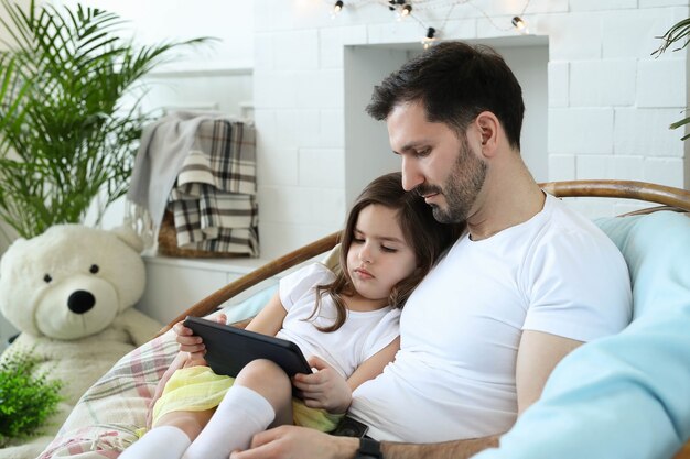 Dad and daughter together at home