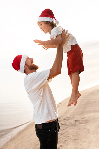 Dad and son celebrating christmas in july