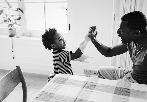 Free photo dad and son playing together