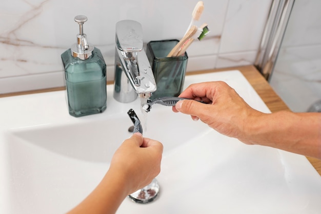 Dad teaching his boy how to shave