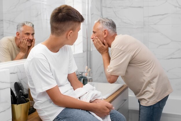 Dad teaching his boy how to shave