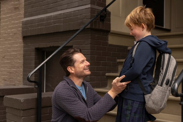 Dad walking his kid for first day of school