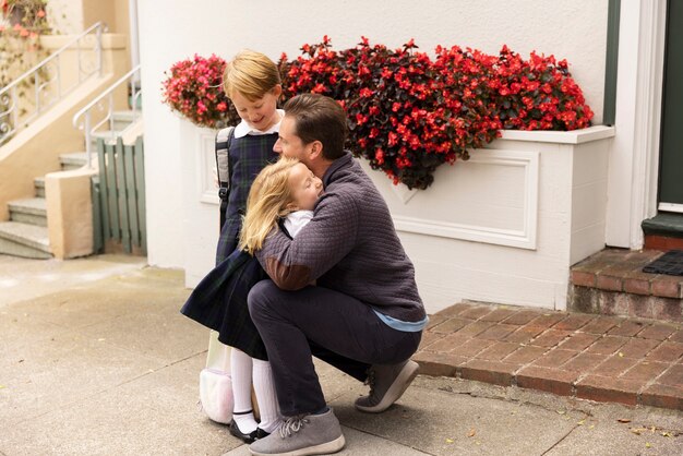 Free photo dad walking kids for first day of school